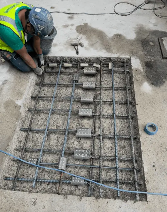 Crew performing concrete restoration